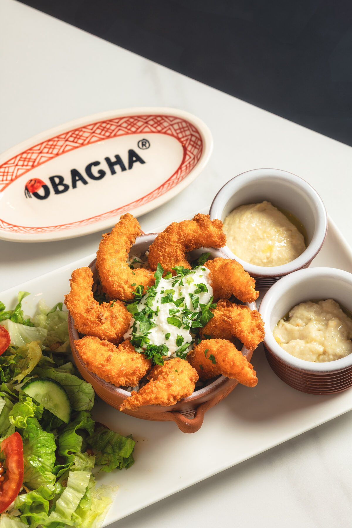 Assiette signée O'Bacha, plat de crevettes